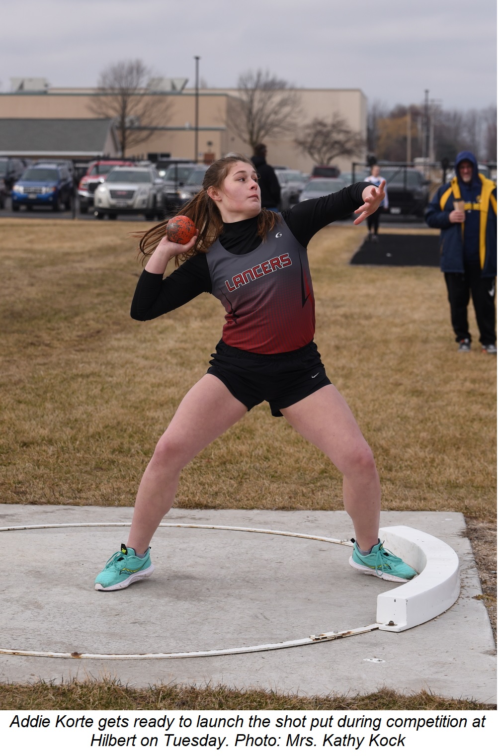 Addie Korte gets ready to launch the shot put during competition at Hilbert Tuesday.