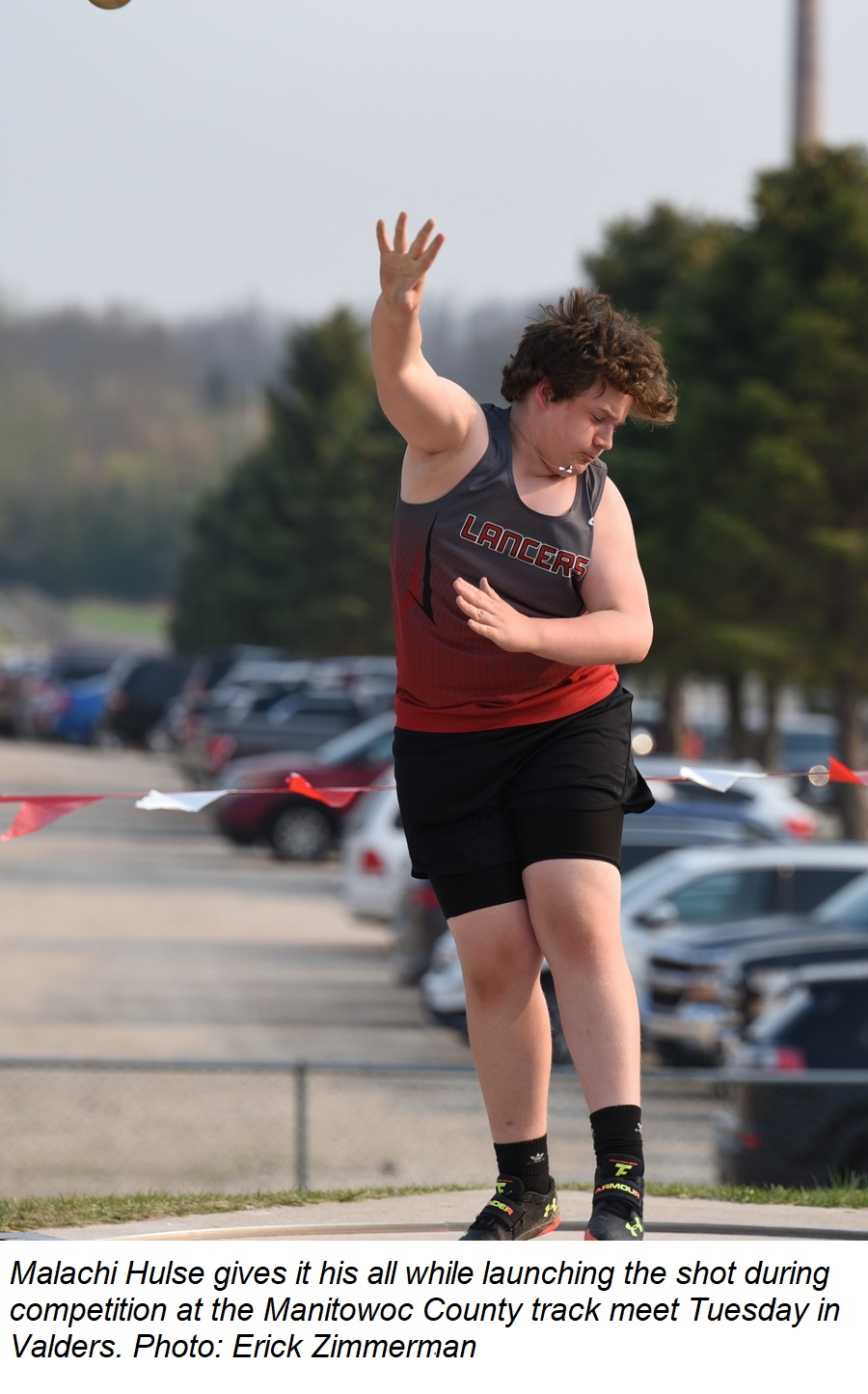 Malachi Hulse gives it his all while launching the shot during competition at the Manitowoc County track meet Tuesday.