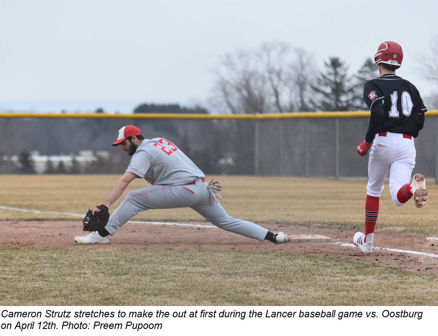 Cameron Strutz stretches for the out at first base during the game at Oostburg April 12th.