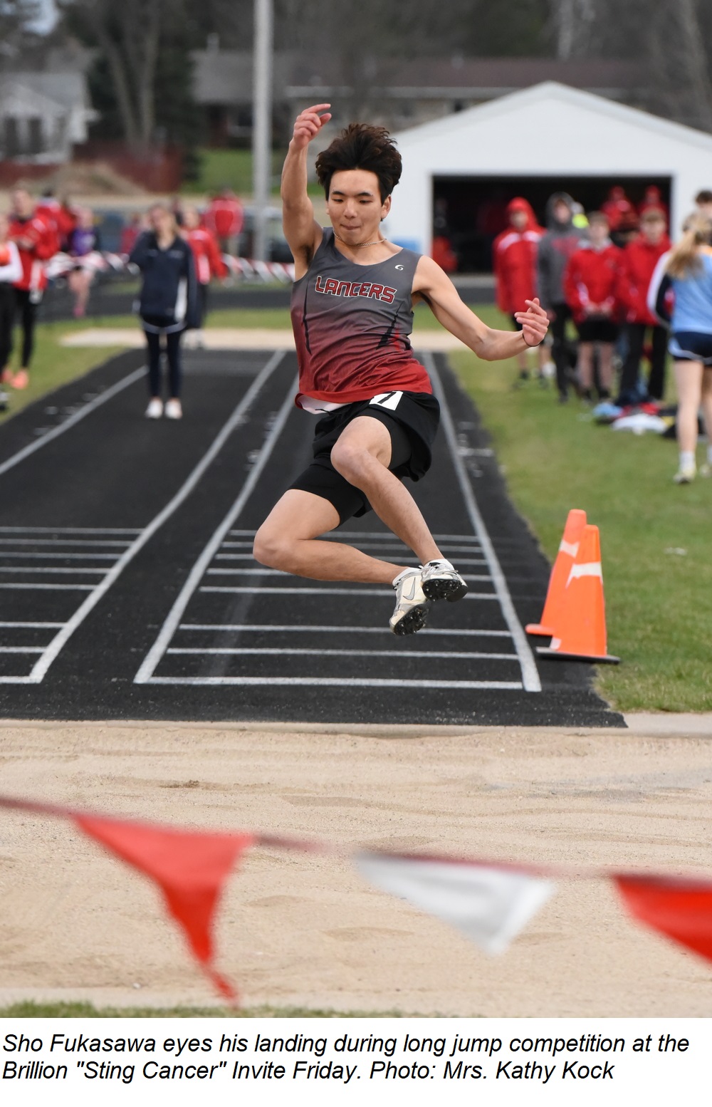 Sho Fukasawa eyes his landing during long jump competition at the Brillion Invite Friday.