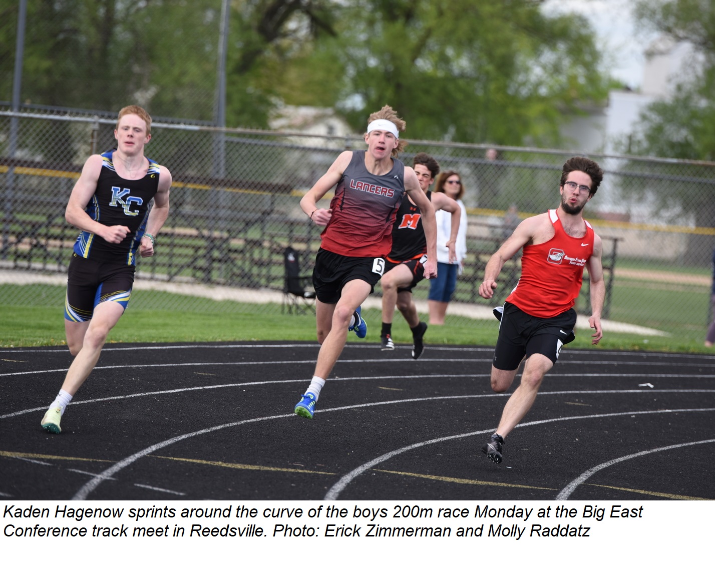 Kaden Hagenow sprints around the 200m curve during the Big East Conference track meet Monday in Reedsville.
