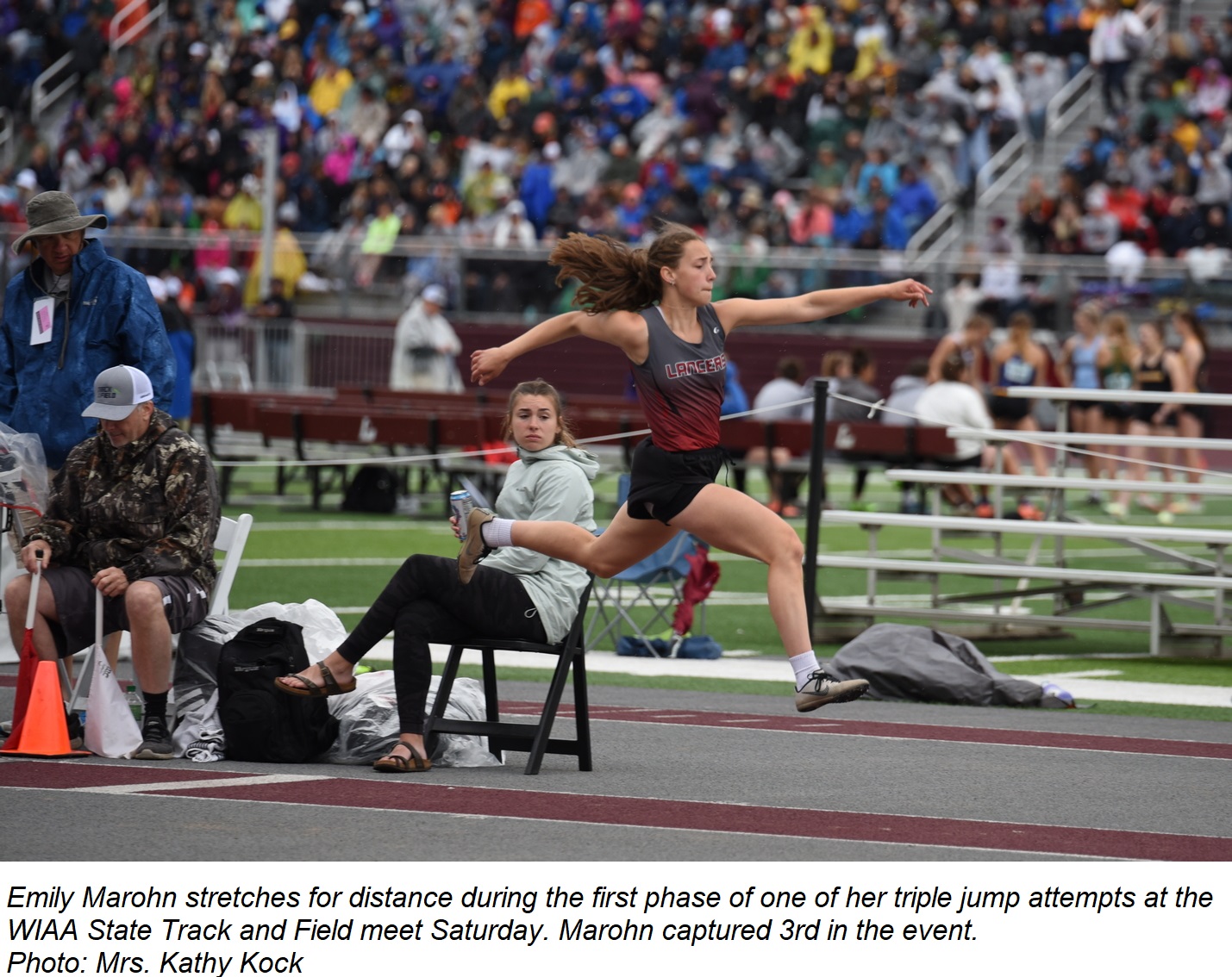 Emily stretches for distance during the first phase of one of her triple jump attempts at the WIAA State Track and Field Meet.